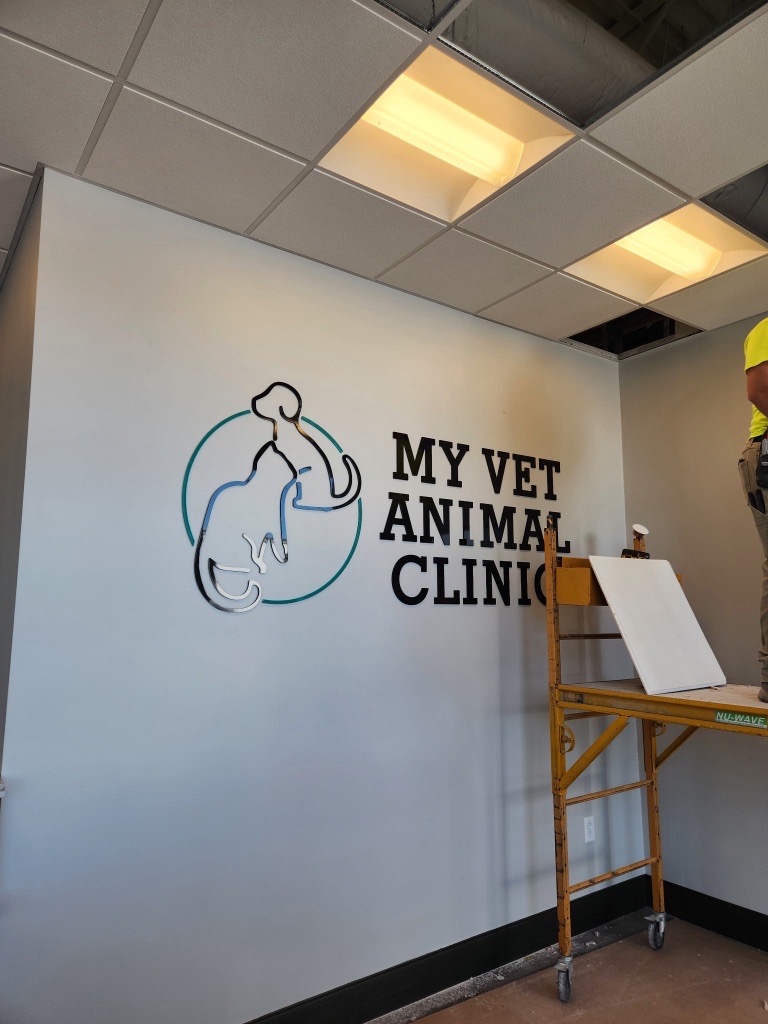 wall inside a My Vet Animal Clinic displays a logo wall inside a My Vet Animal Clinic displays a logo